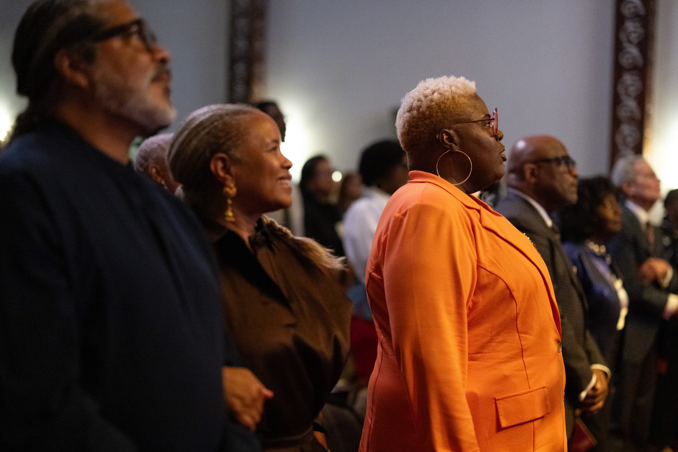 Valencia Gunder and other honorees sing "Lift Every Voice and Sing"