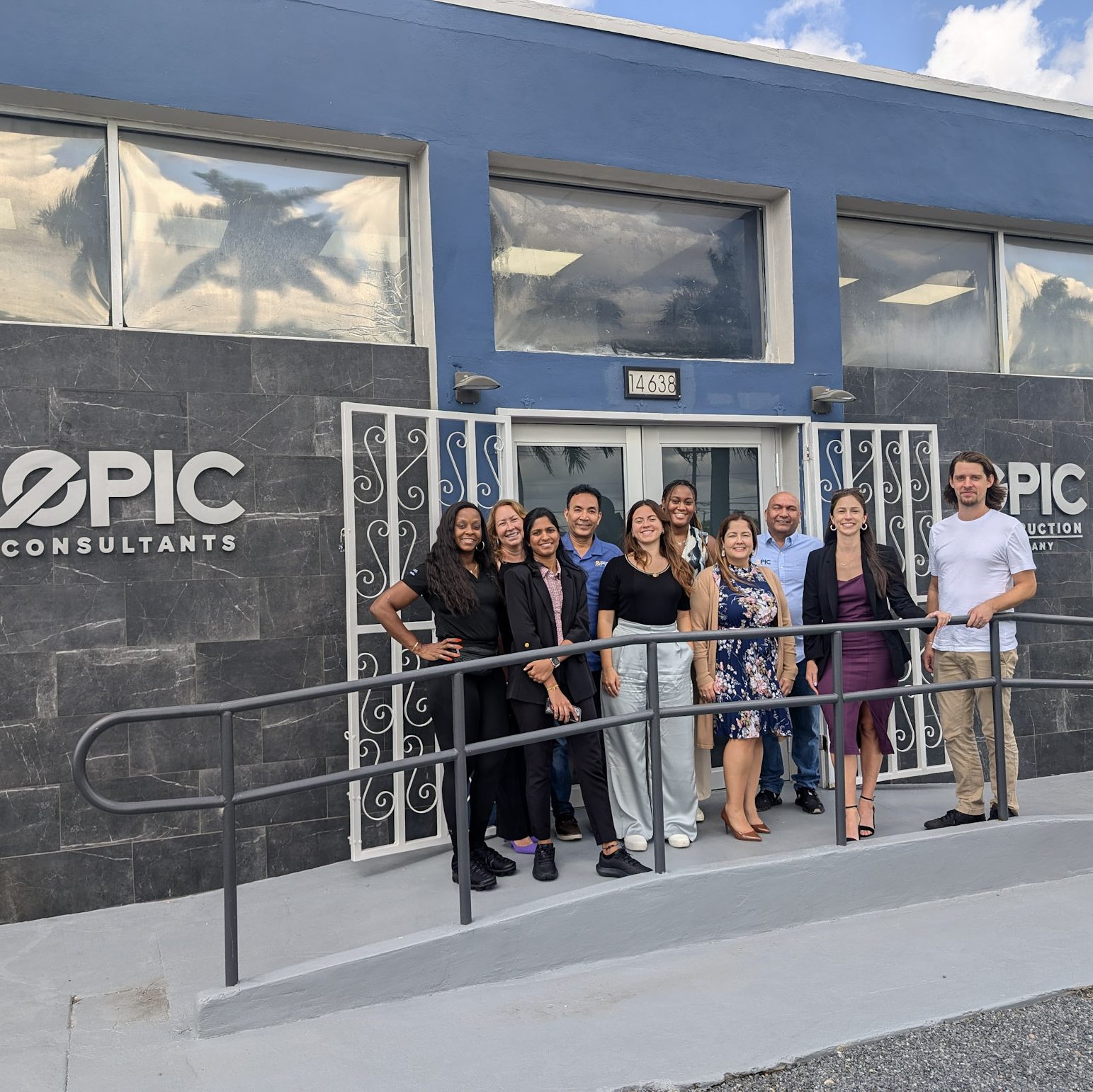 Epic Consultants team smiles in front of their new property acquired via Miami Open for Business.
