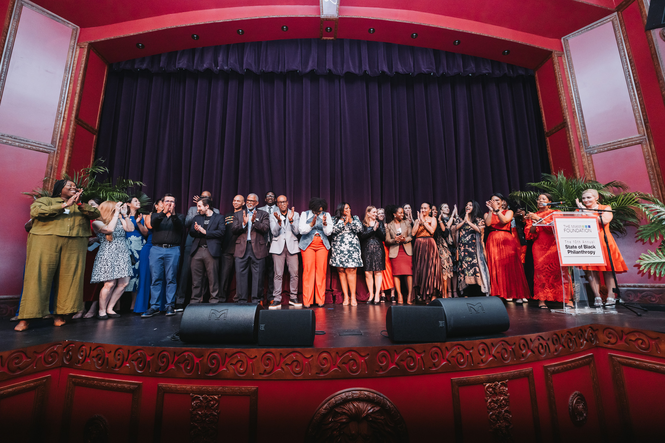 Large group of people gathered on stage