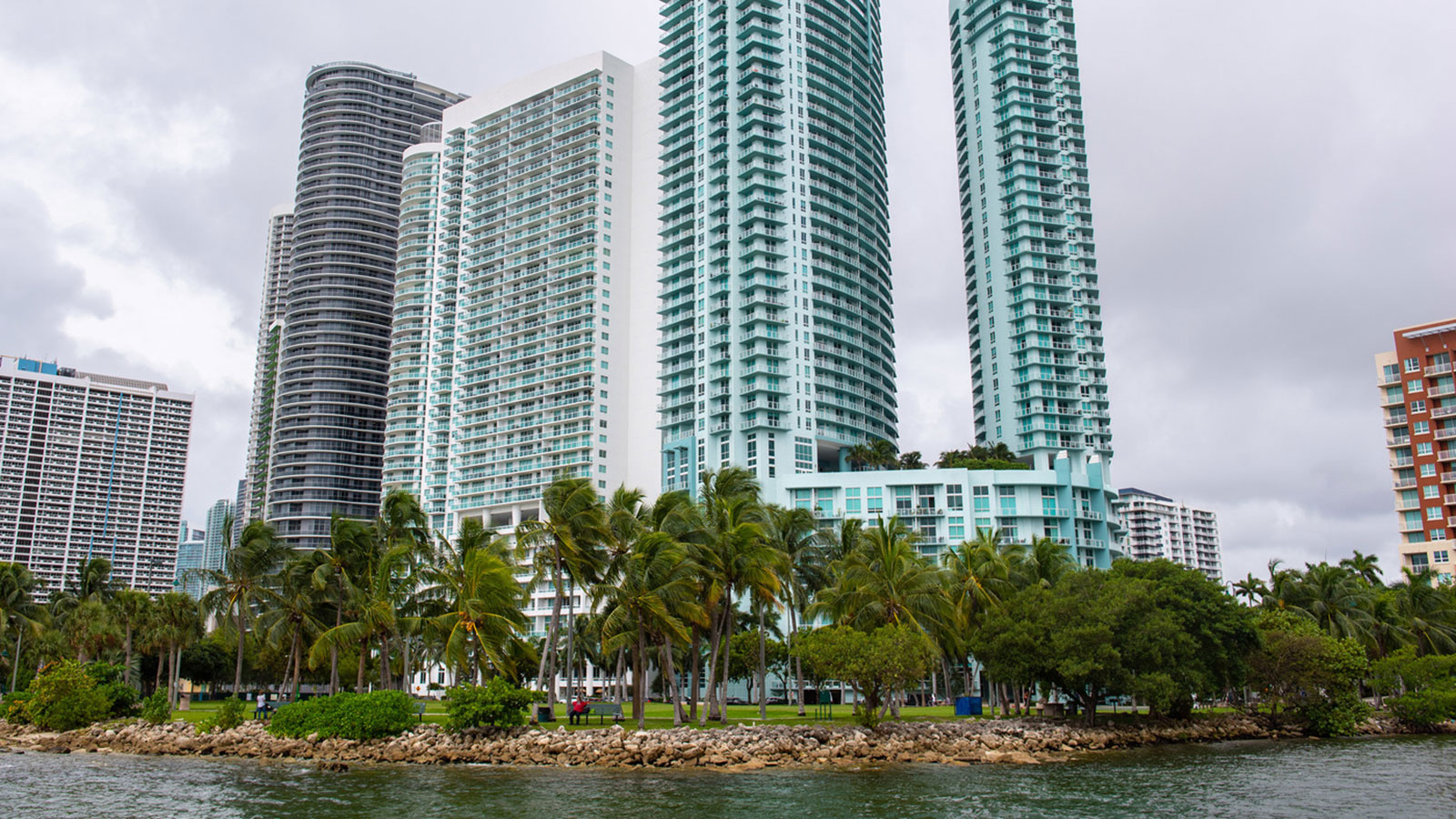 High rise buildings viewed from the water | Labor Miami