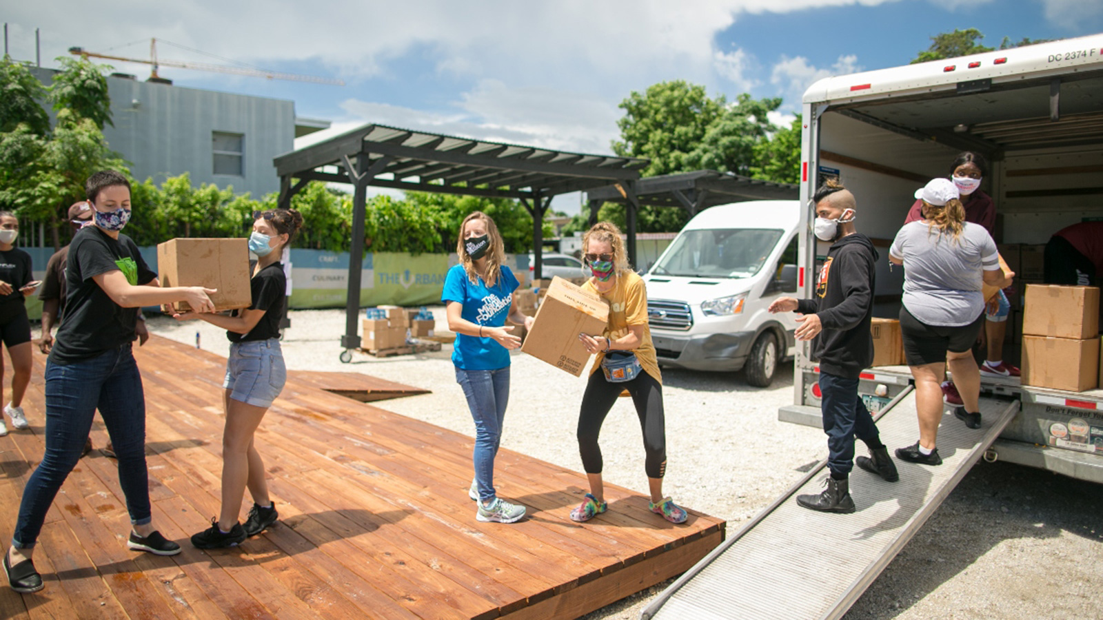 People unloading a van for COVID 19 Recovery