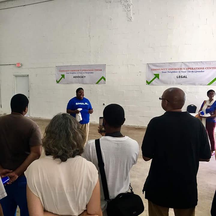 Group of people listening to a speaker