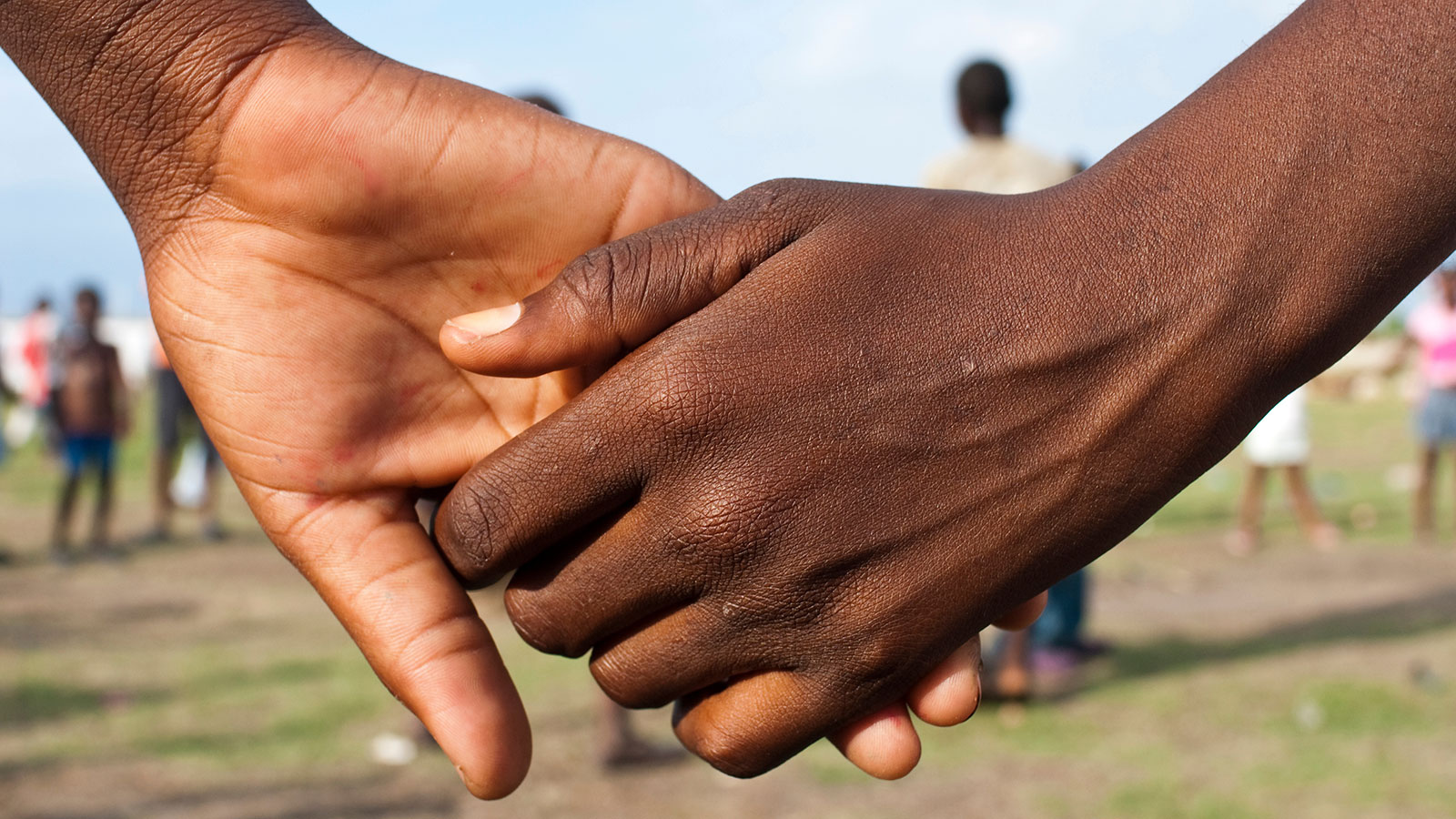Holding hands. Haitian-led organizations. Holding hands. Haitian-led organizations.