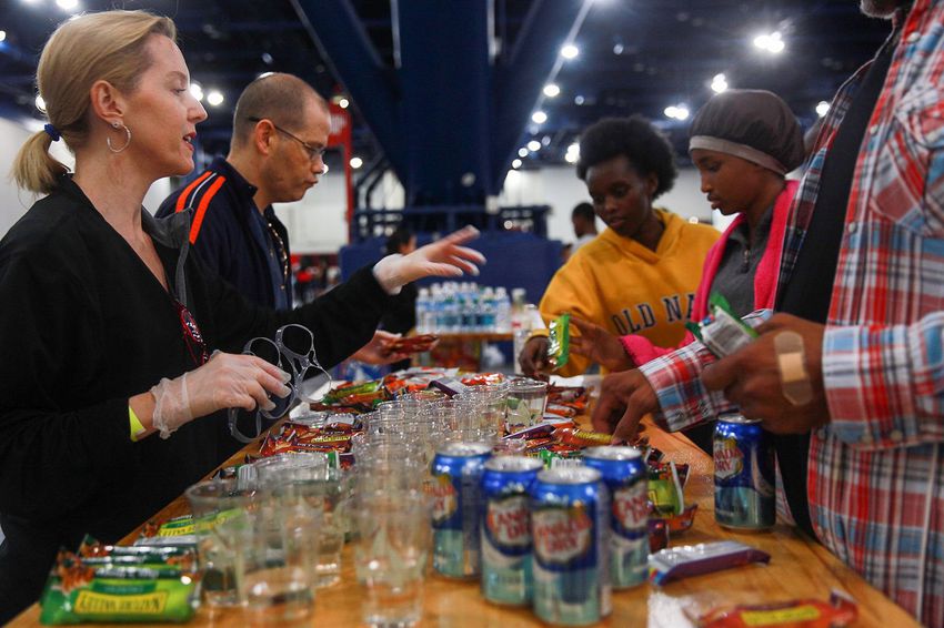 People putting together hurricane help.