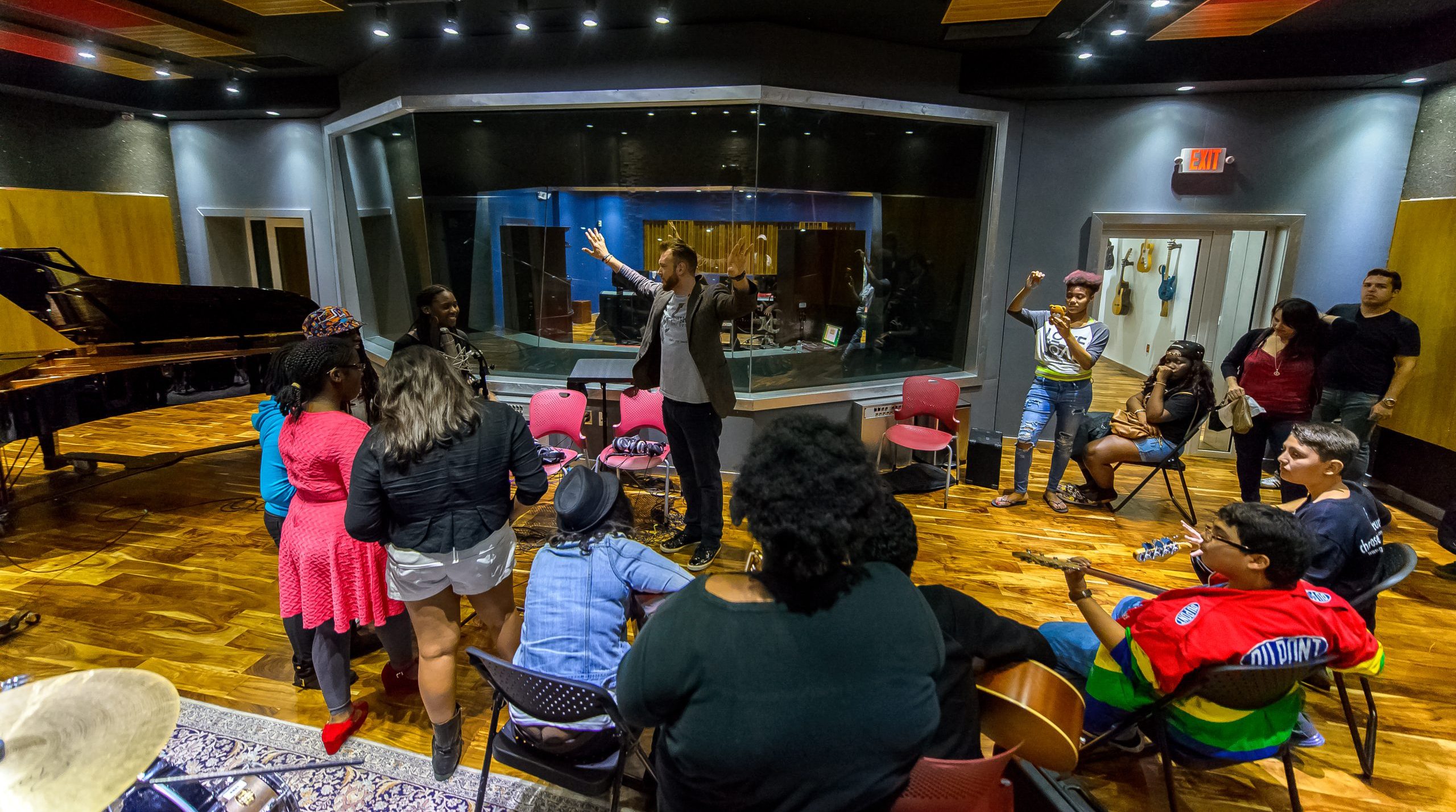2019 Ruth Shack Leadership Award Honoree Chad Bernstein stands with Guitars Over Guns students.