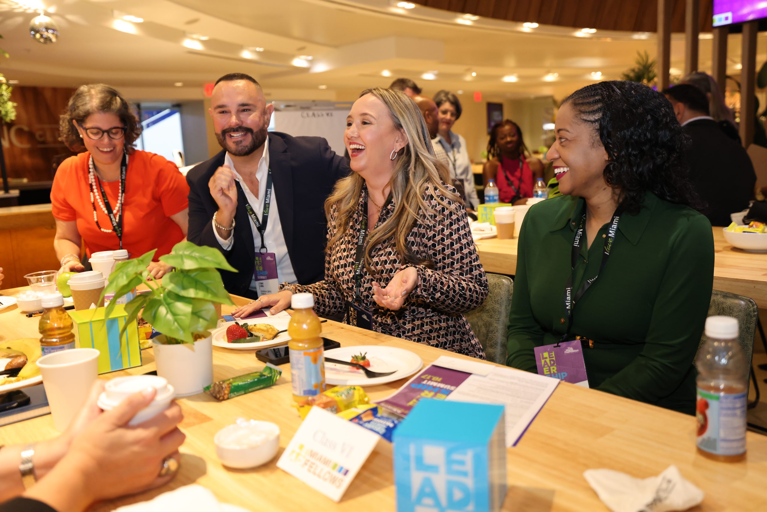 Miami Fellows eating breakfast and catching up around a table.