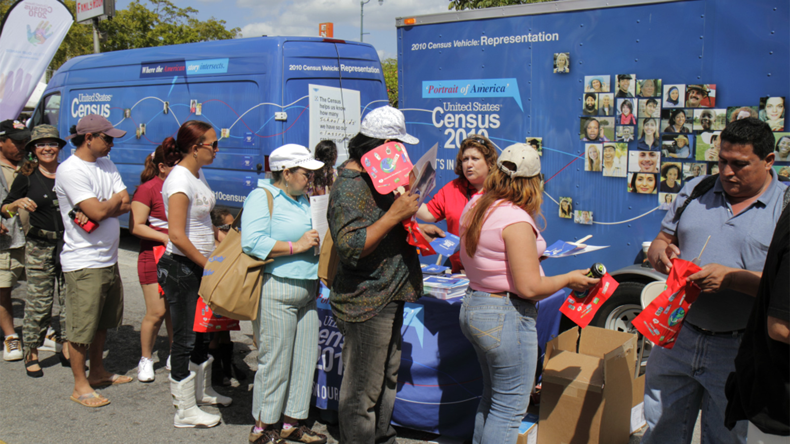 People standing in line in front of a United States Census van | Miami Dade Counts