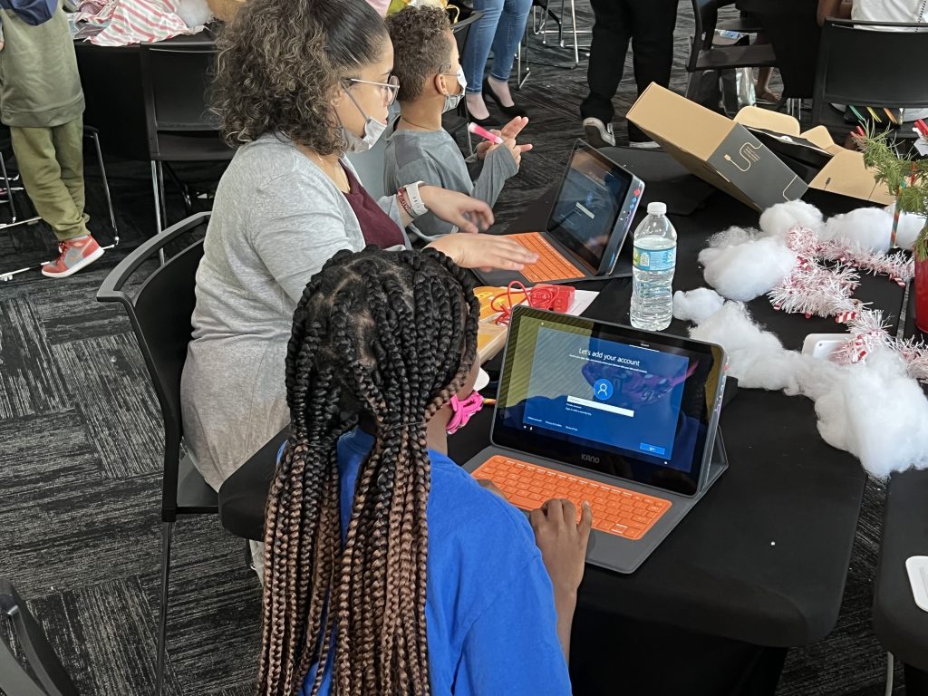 people using laptops at a table