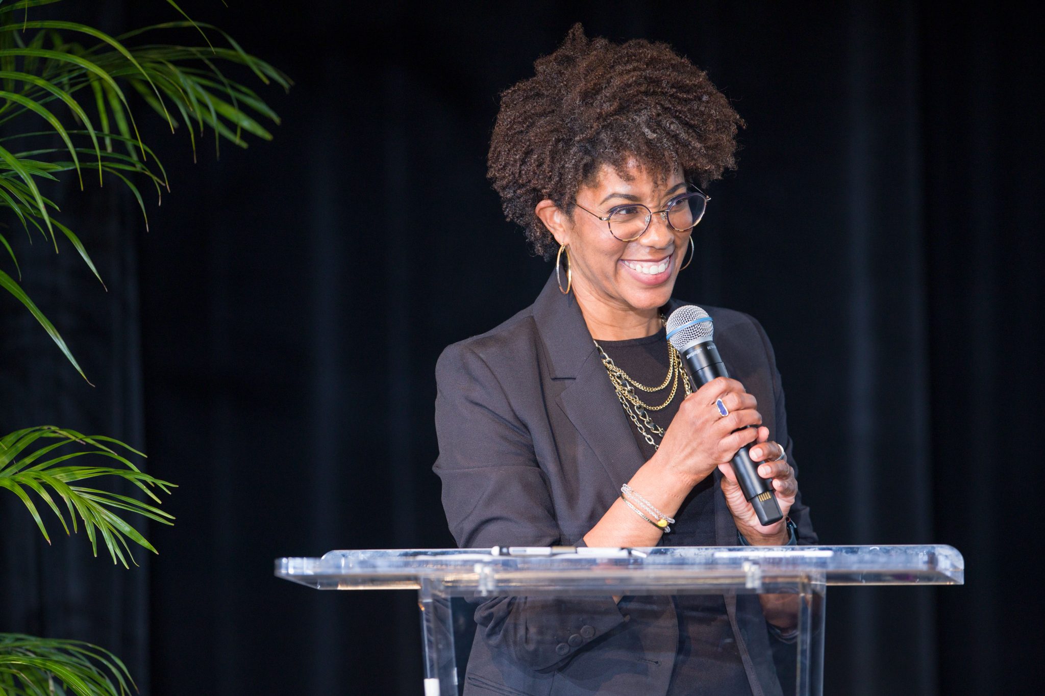 Woman standing with microphone | 2024 State of Black Philanthropy