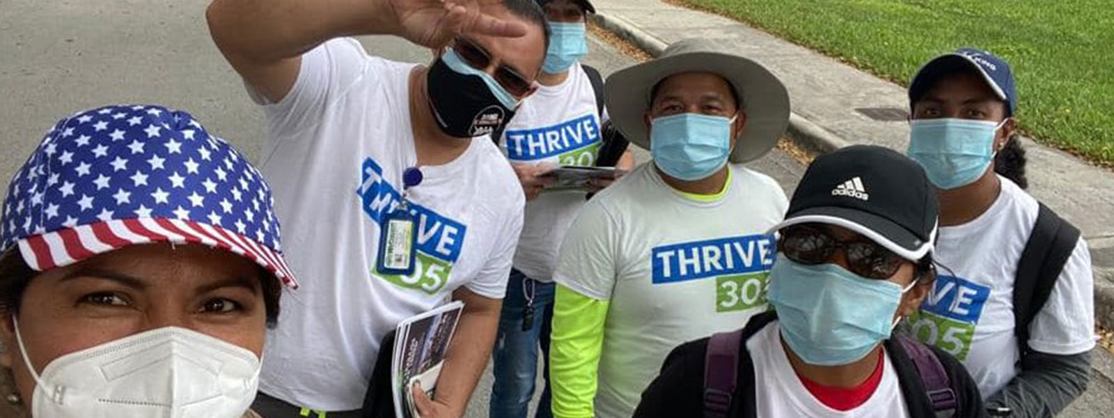 Group of people wearing Thrive 305 tshirts