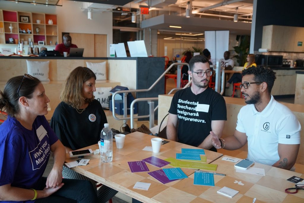 A group gathers for a My Miami Story conversation at Venture Cafe Miami.