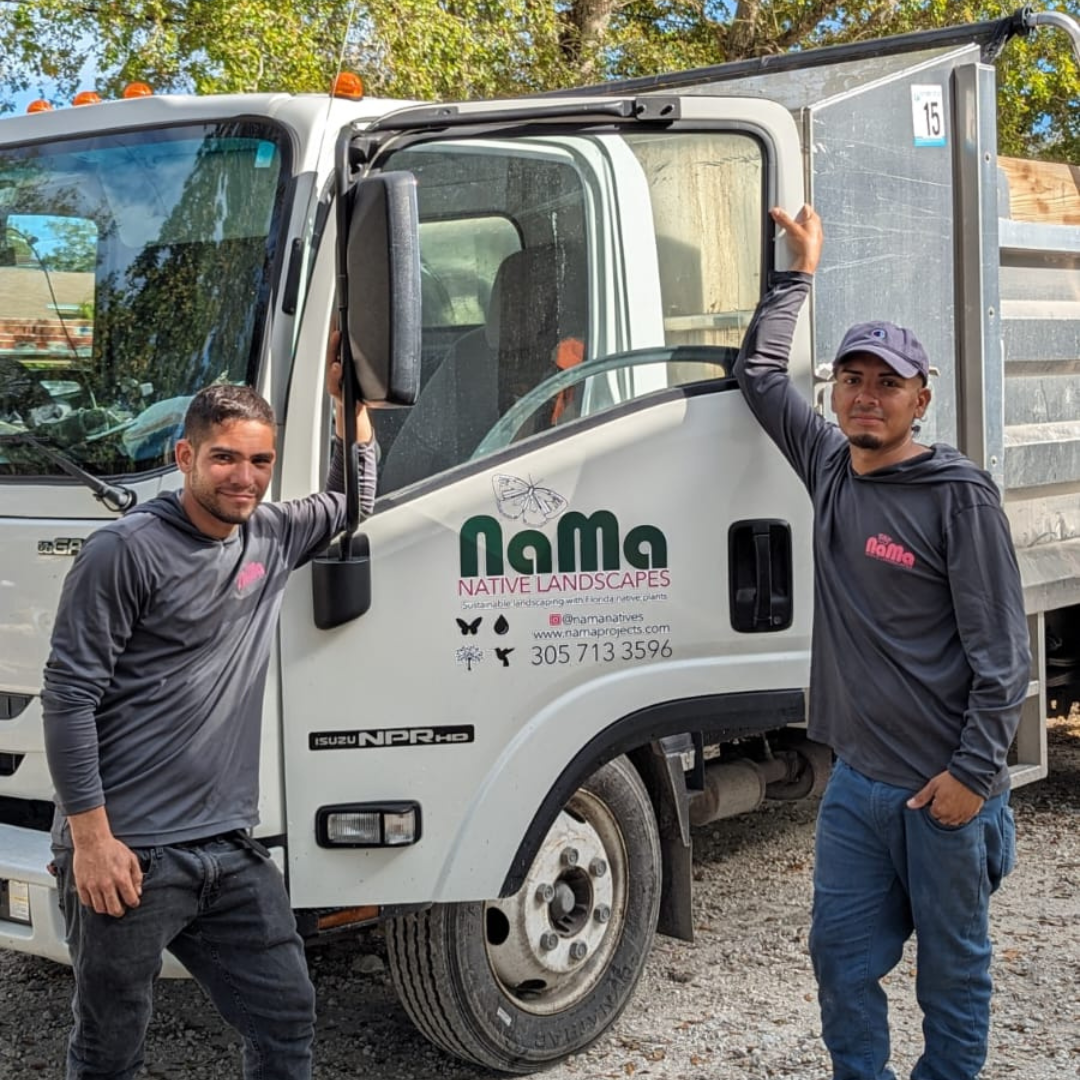 NaMa Nature Landscapes workers pose in front of the truck the company was able to purchase via Miami Open for Business.